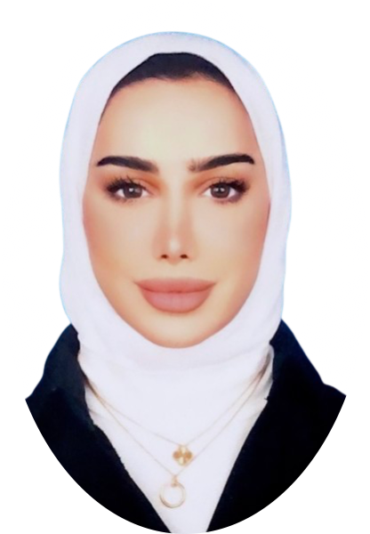 Woman wearing a white hijab and a black blazer, smiling.