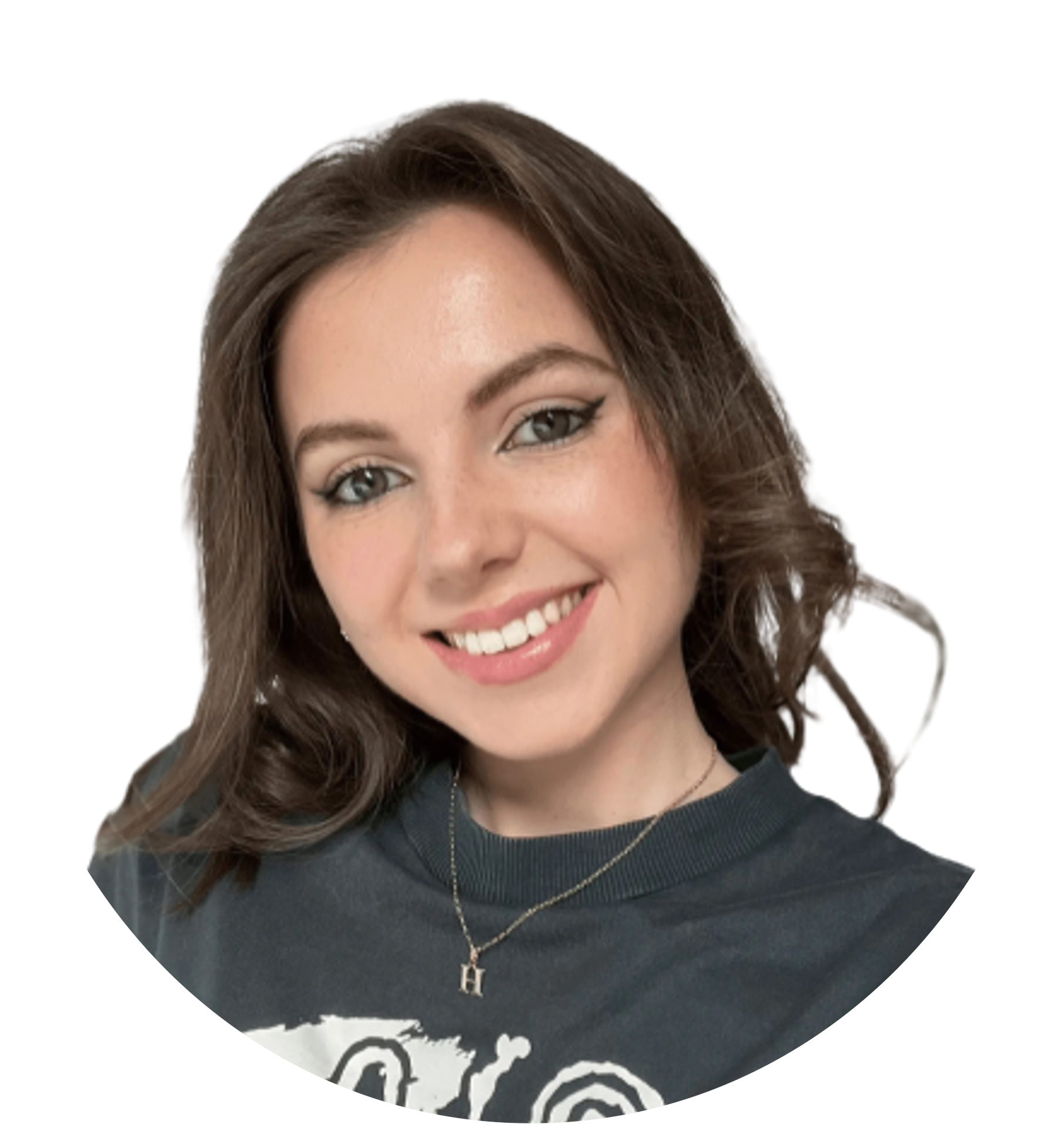 Woman smiling, wearing a dark shirt and a necklace with the letter