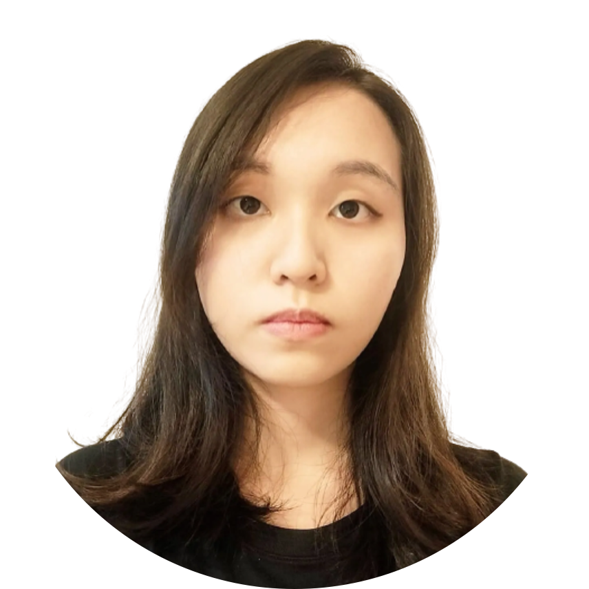 Woman with dark hair looking directly at the camera, wearing a black shirt.
