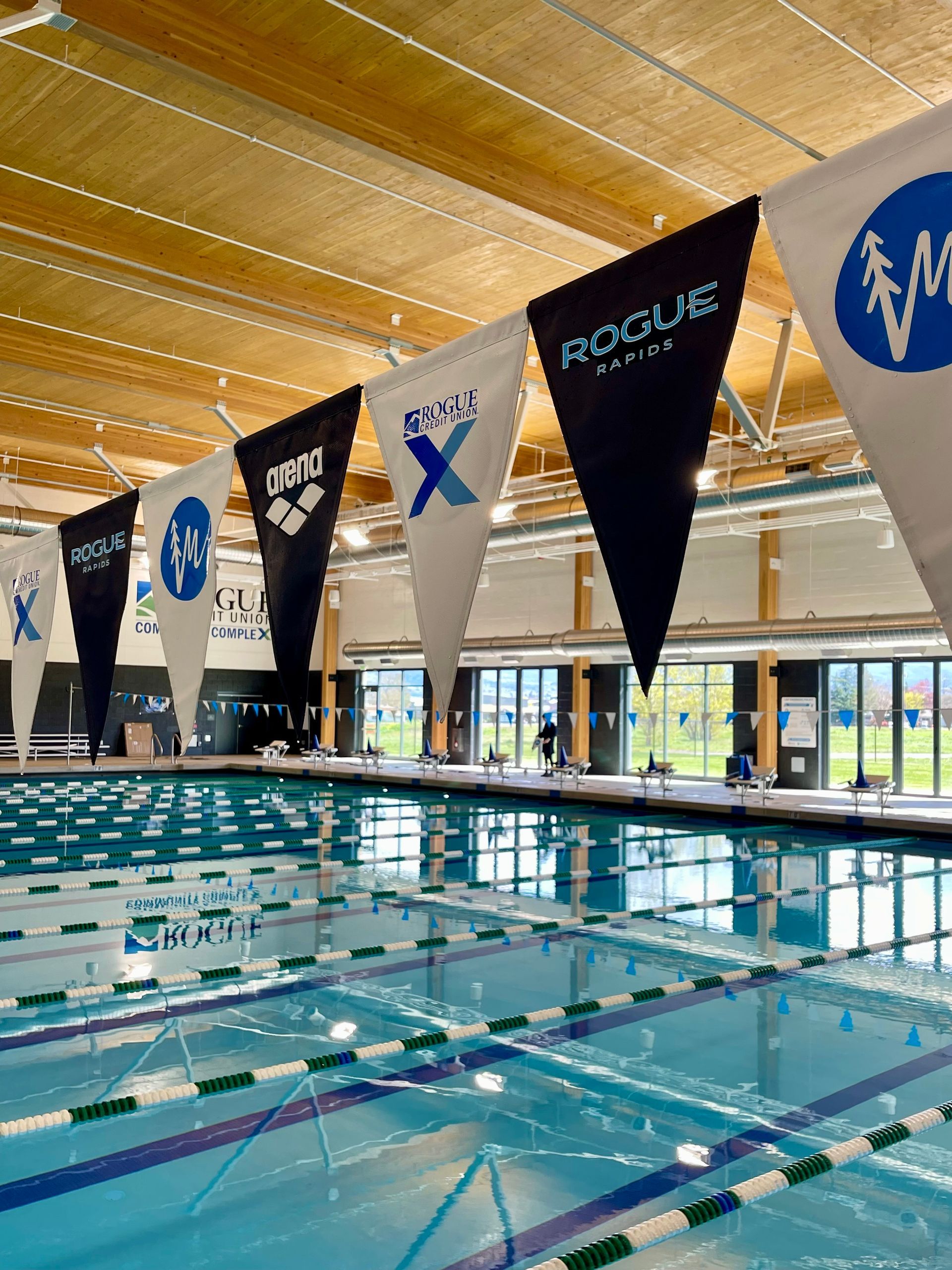 a group of people are swimming in a pool