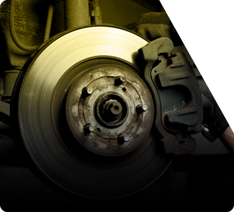 Close-up of a car brake rotor and caliper inside the wheel well | The Recon Garage