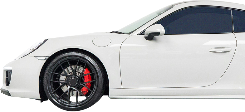 White sports coupe side view with black rims and red brake calipers | The Recon Garage