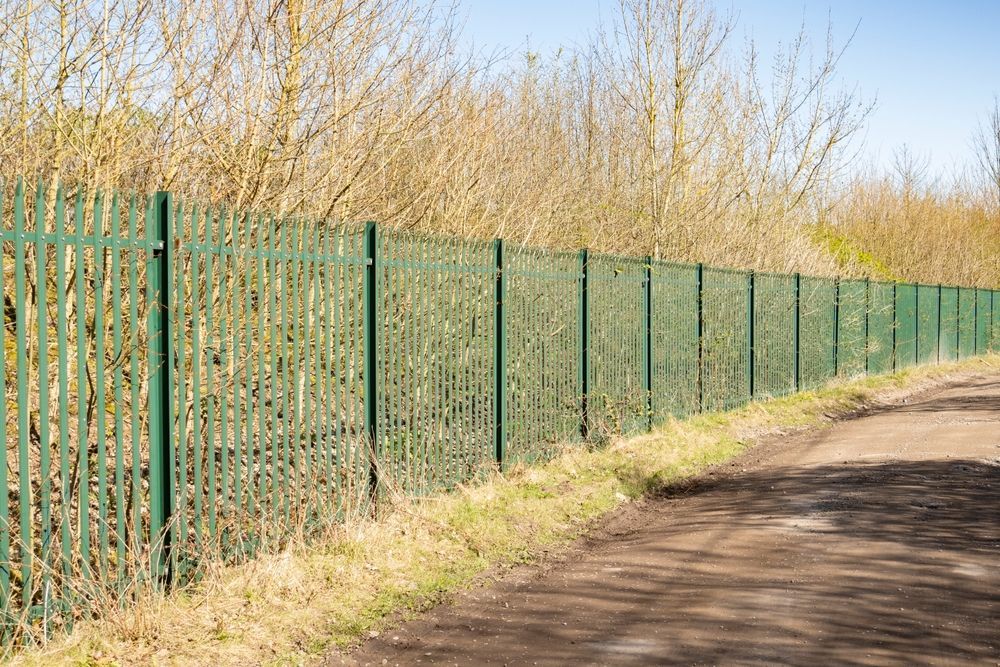 Green Metal Fence Bordering a Path — Fencer Steve In Kempsey, NSW