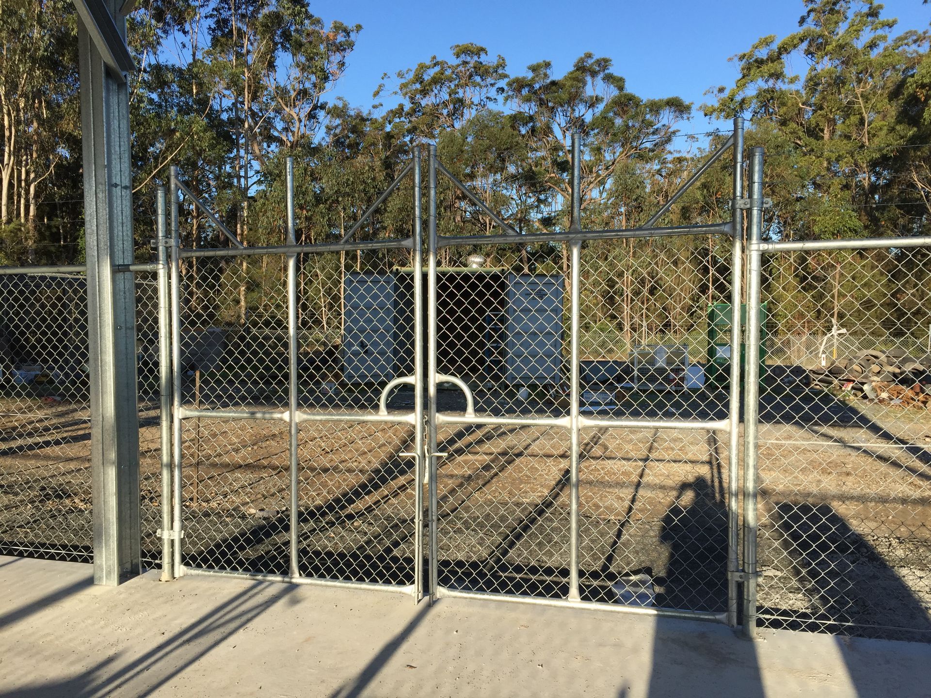 Chain-link Fence With Double-gate Entrance, Metal Posts, and a Concrete Path — Fencer Steve In Crescent Head, NSW