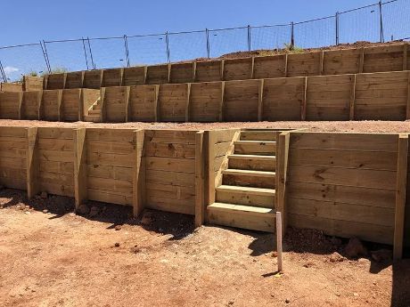 Wooden Terraced Retaining Walls With Stairs Built Into the Structure — Fencer Steve In Hat Head, NSW