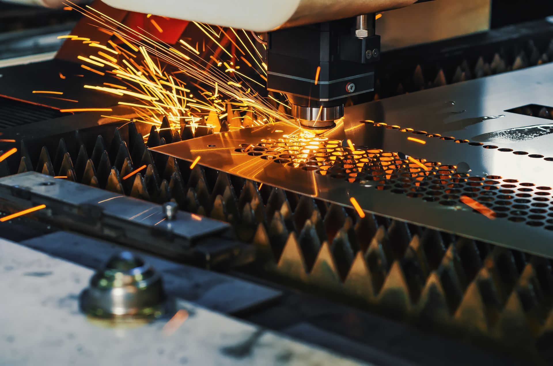 Laser cutting a metal sheet