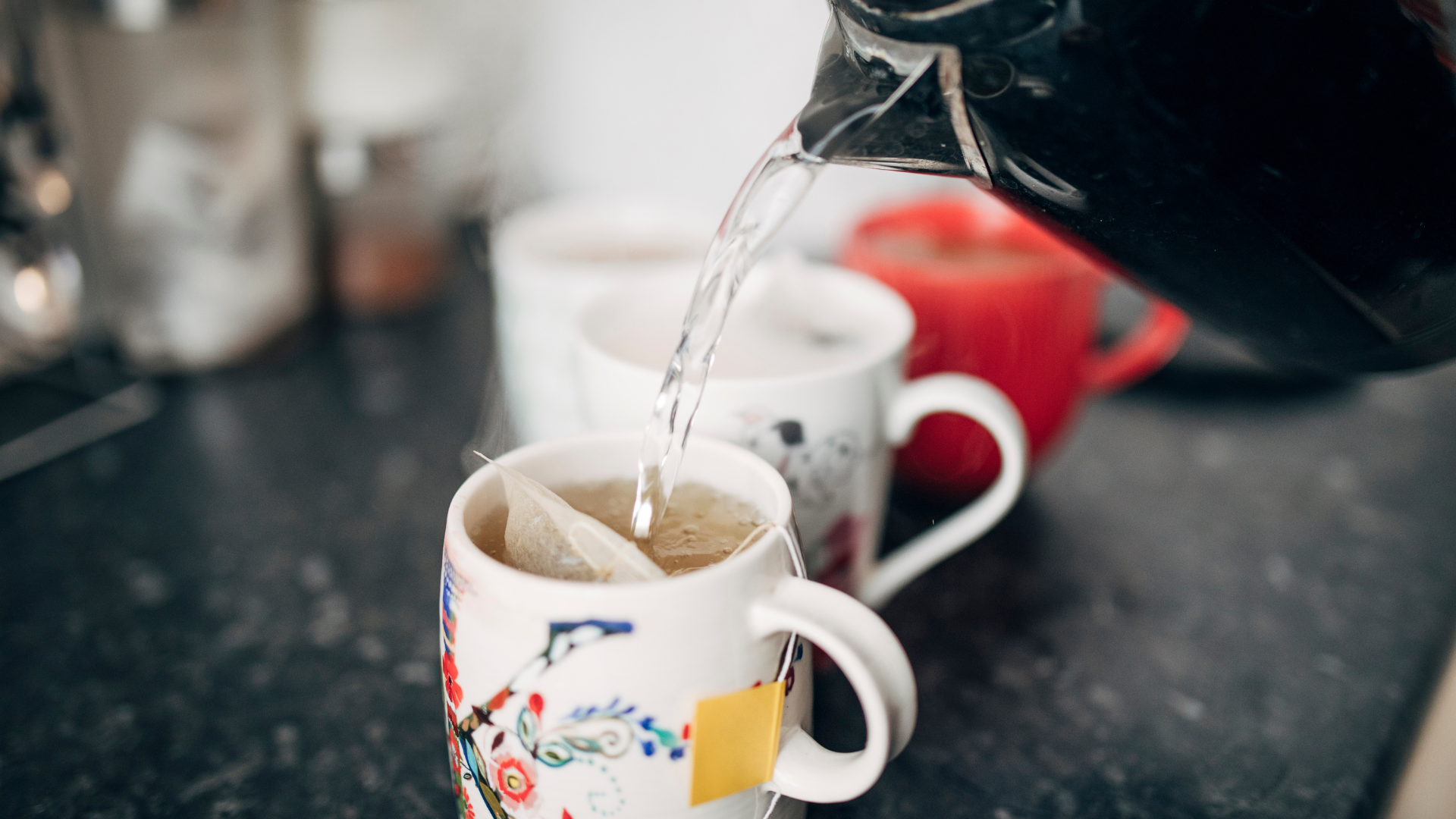 pouring hot water on a teabag