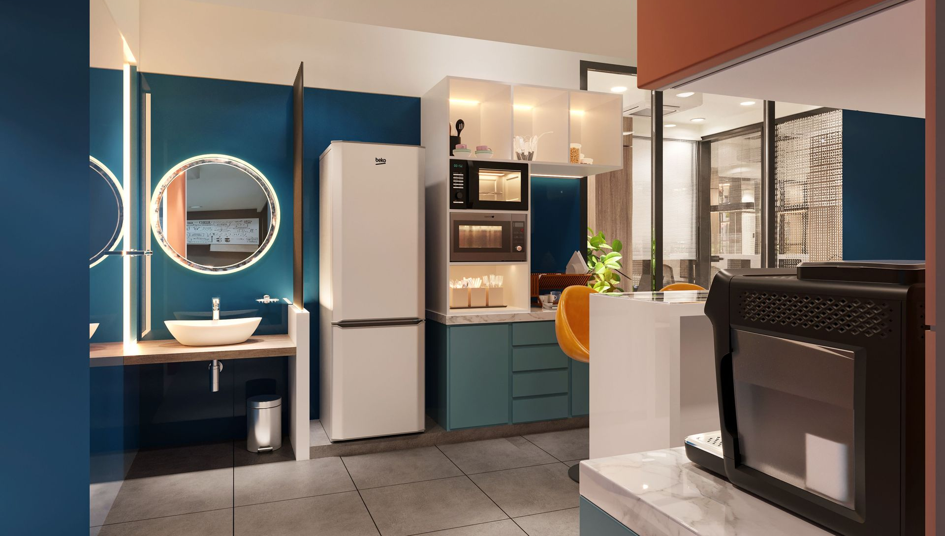 Modern kitchen with blue cabinets, white fridge, desk nook, and microwave on the counter