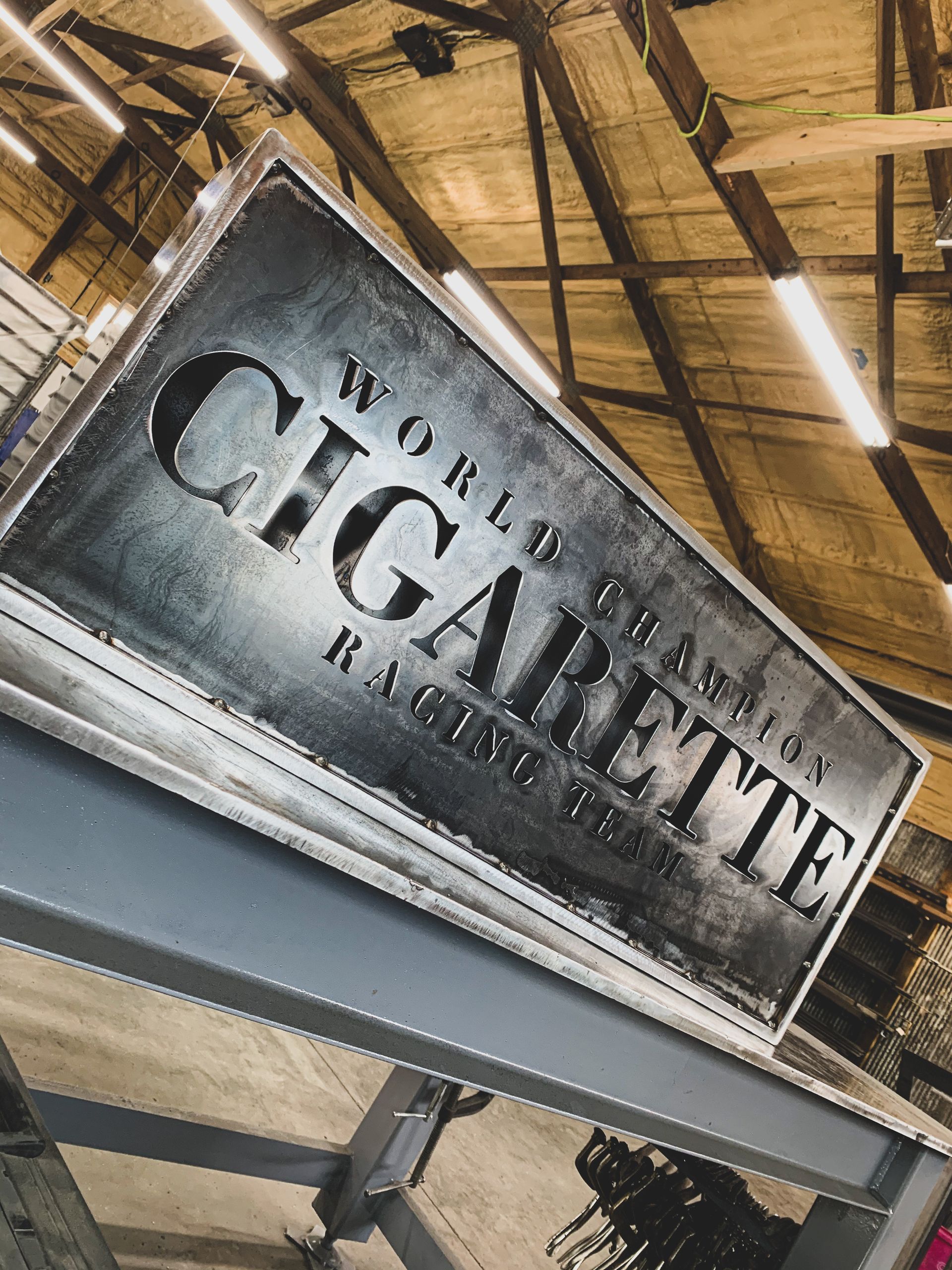 A Metal Sign Titled 