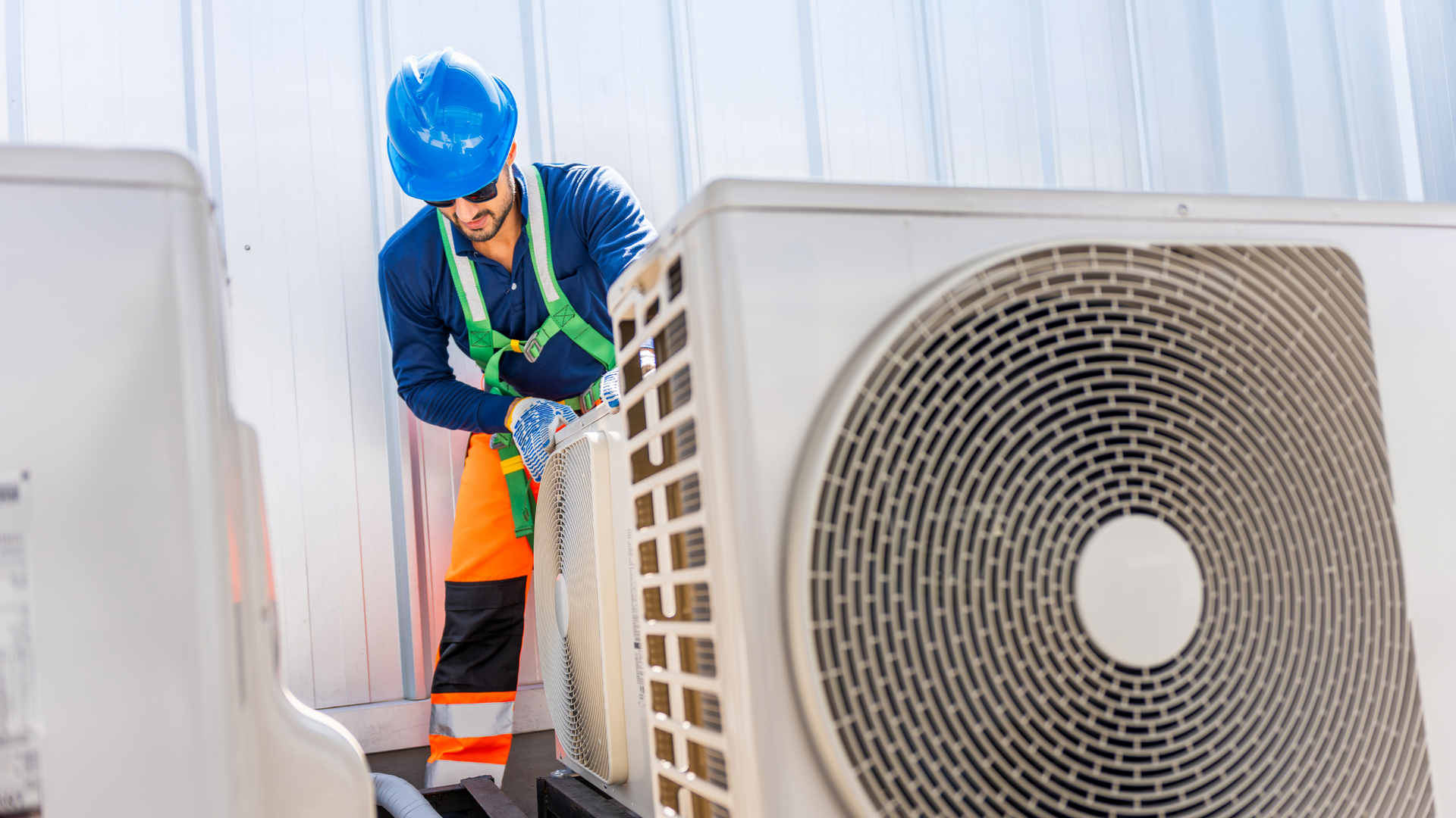 HVAC technician inspecting a commercial unit.