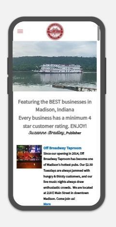 A cell phone with a website on it that says experience the best of madison indiana