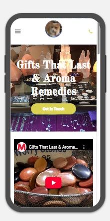 A cell phone displaying a website about gifts that last and aroma remedies.
