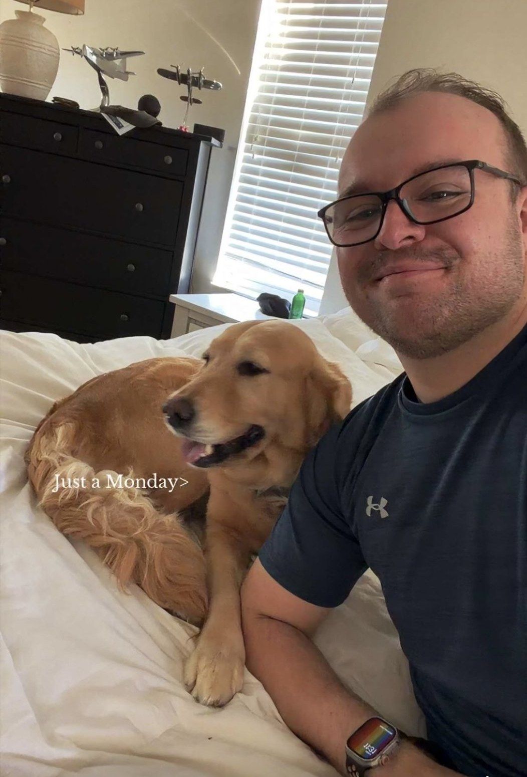 Family member relaxing with a golden retriever