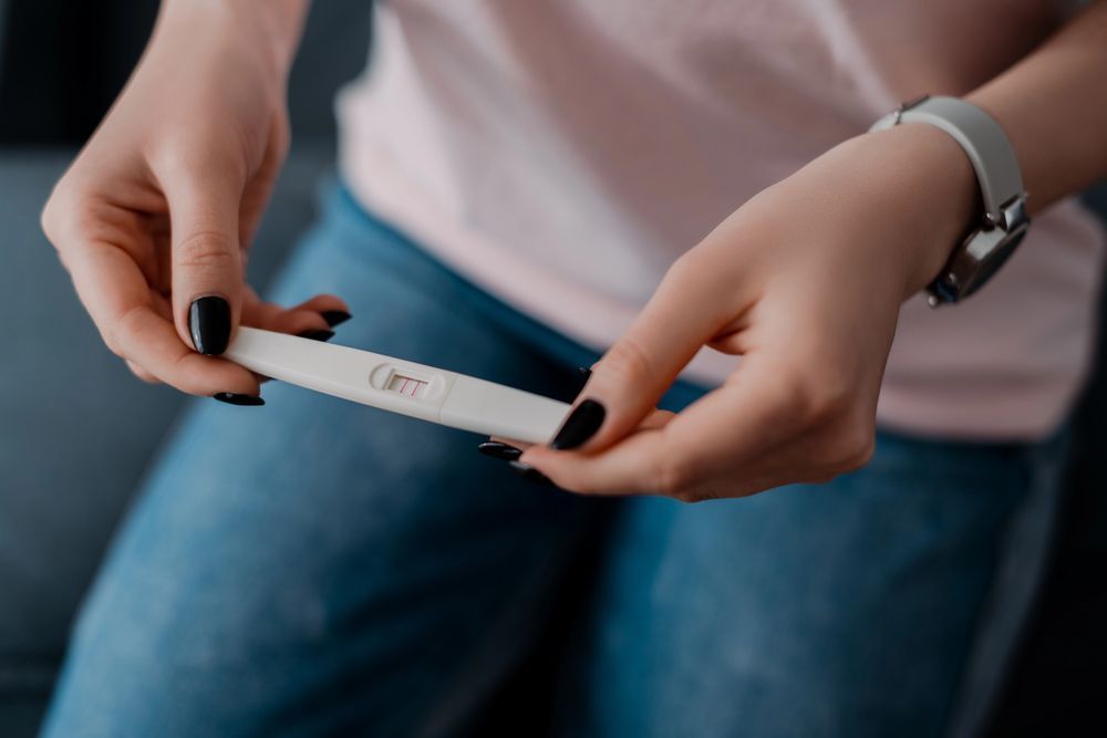 I’m Pregnant, Who Should I Tell? Navigating Hard Conversations With Your Partner, Family, or Friends