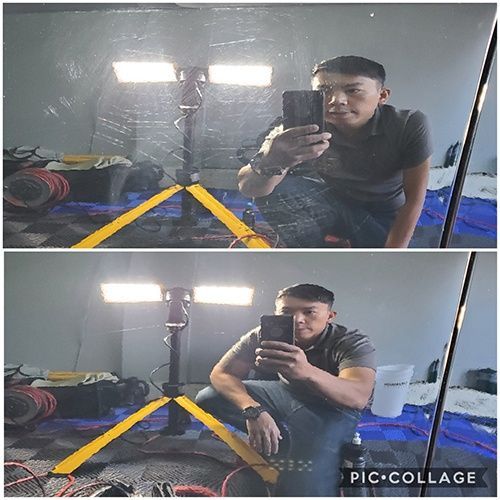 A man is taking a picture of himself in a mirror.