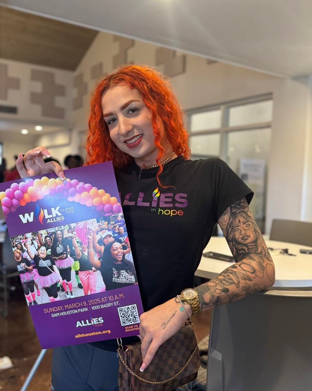 a fem-presenting AIH volunteer with bright orange hair, displaying a promo for Walk to End HIV