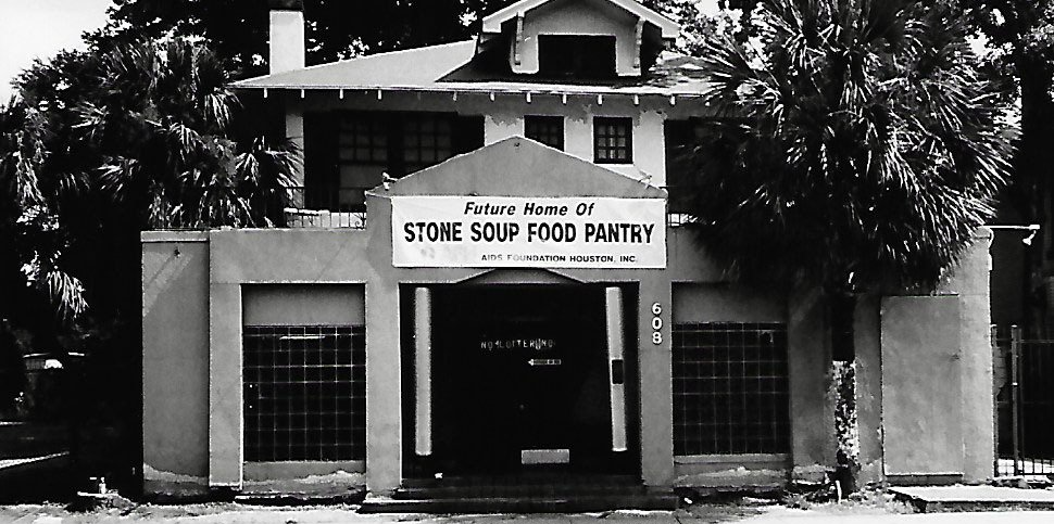 A black and white photo of a building that says stove soup food pantry