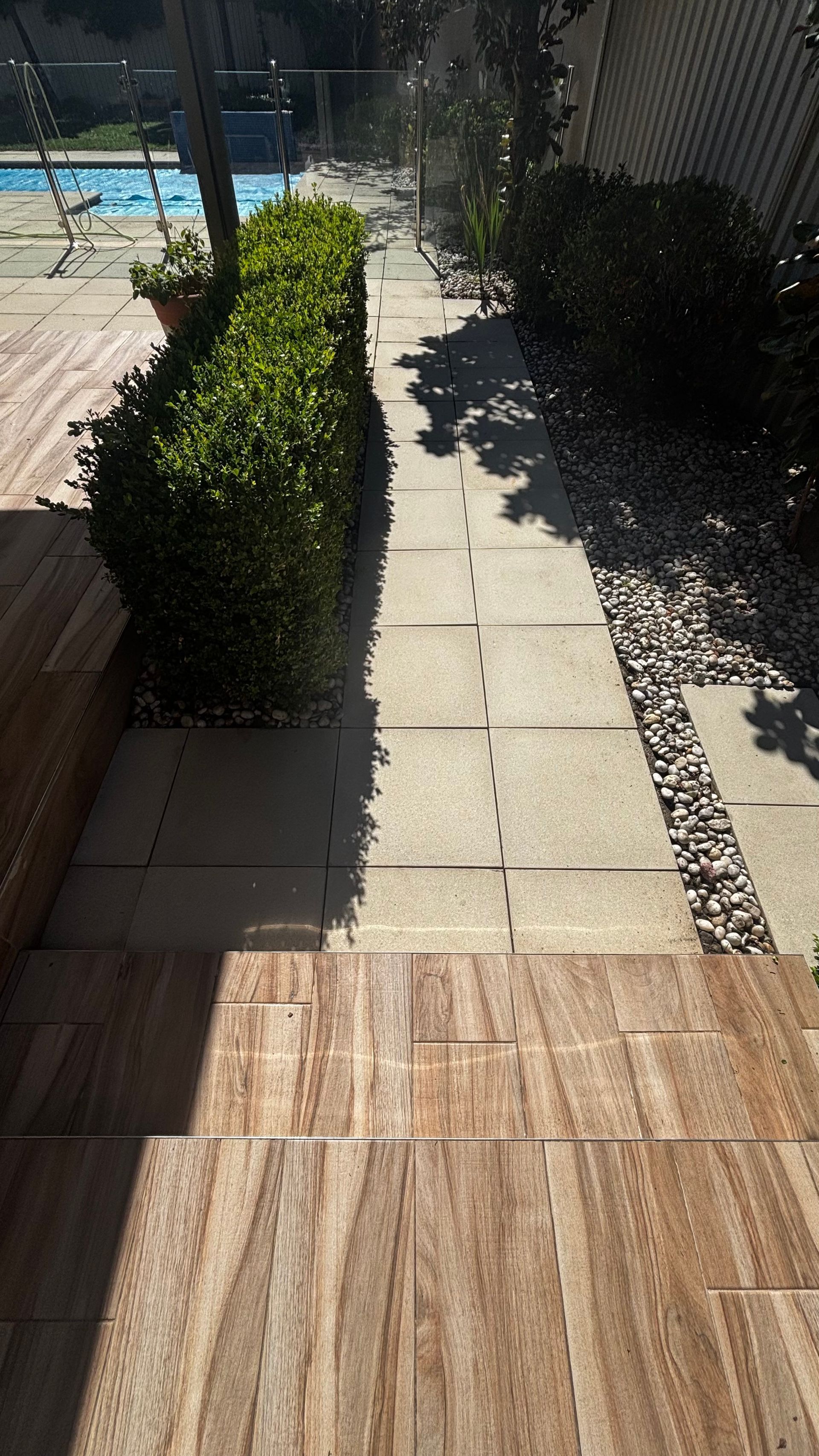 Stone Pathway Runs Alongside a Manicured Green Hedge — Pressure Perfect Cleaning Solutions in Symonston, ACT
