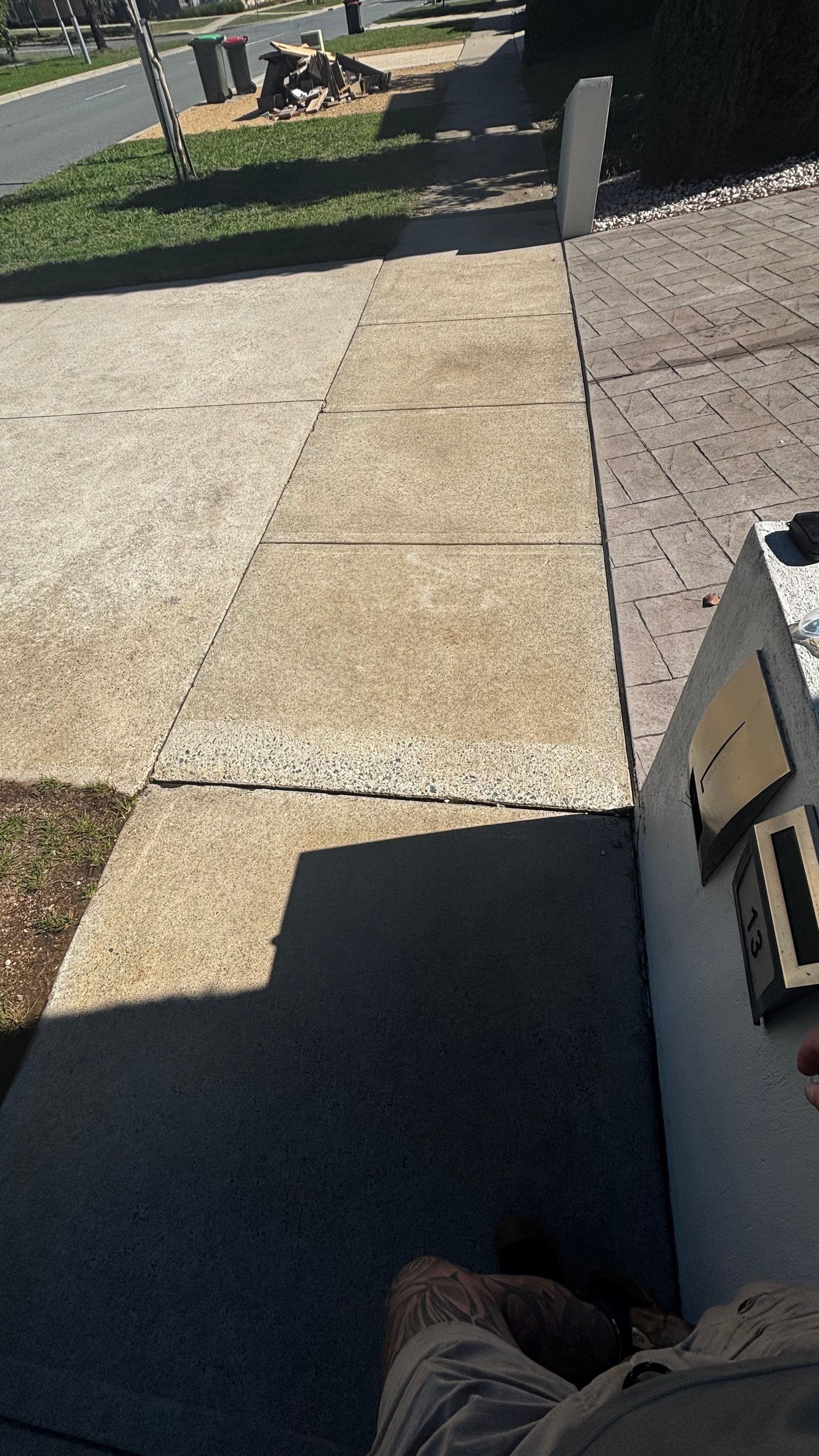 First-person View of a Concrete Sidewalk Leading Street — Pressure Perfect Cleaning Solutions in Symonston, ACT