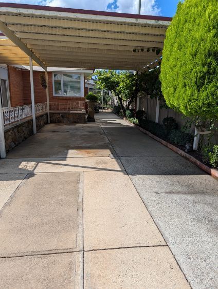 Paved Driveway Leading Toward a House — Pressure Perfect Cleaning Solutions in Tuggeranong, ACT