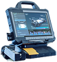 Portable medical diagnostic monitor with touchscreen and attached base, shown in blue-gray casing | European Autowerks – Virginia Beach