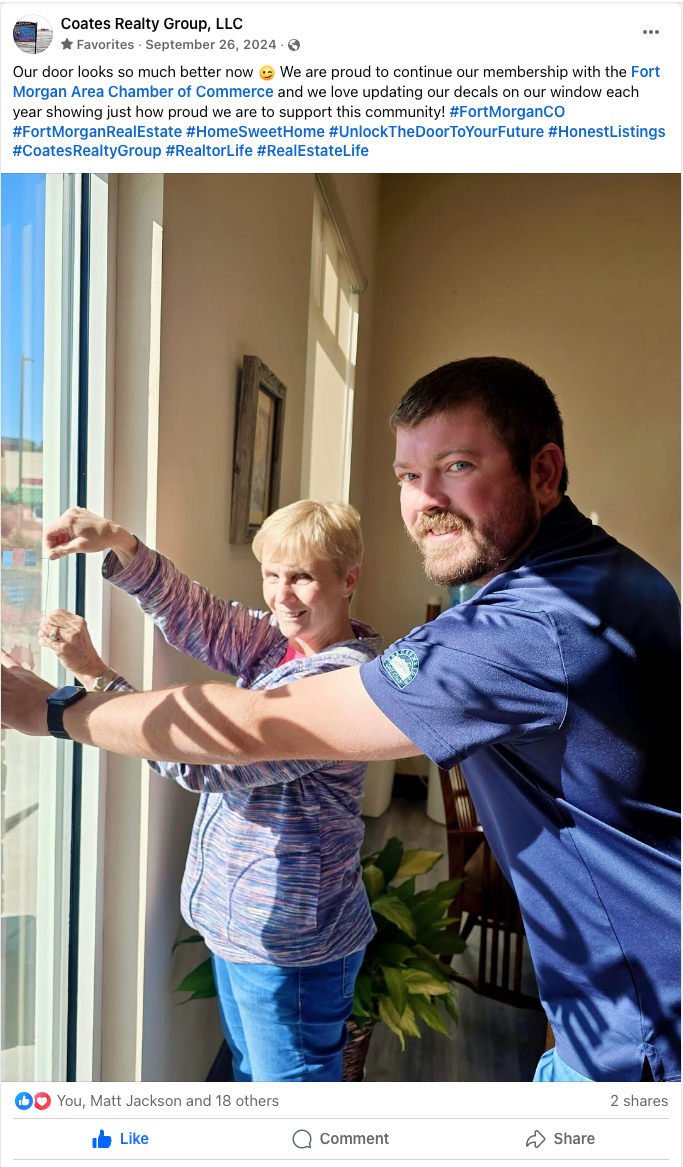 Man assisting a woman with arm stretches in a bright indoor hallway