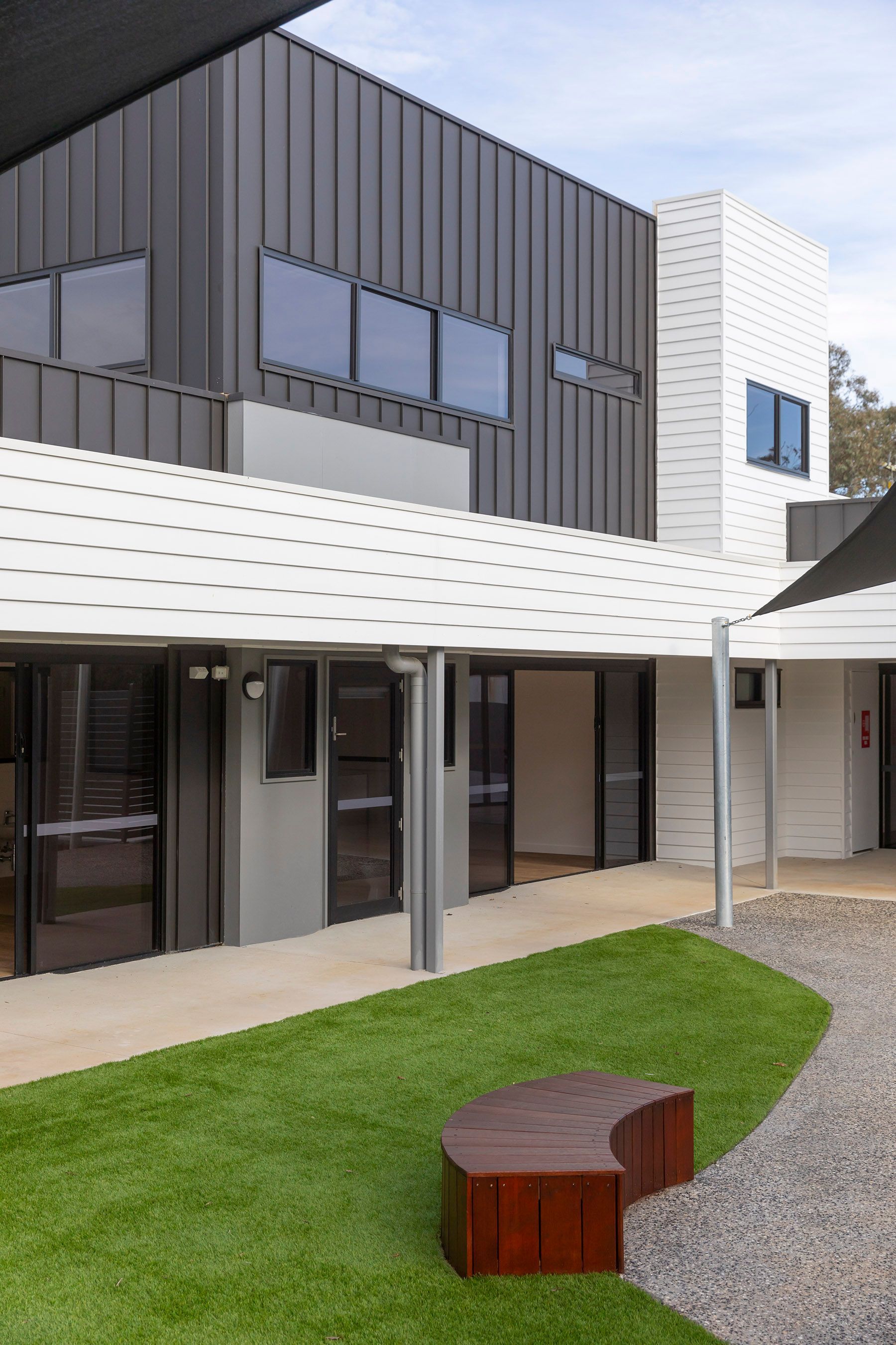 Modern Two-story Building Exterior With a Covered Walkway and Green Lawn — RYDALL BUILDING AND DEVELOPMENT in Freshwater, QLD