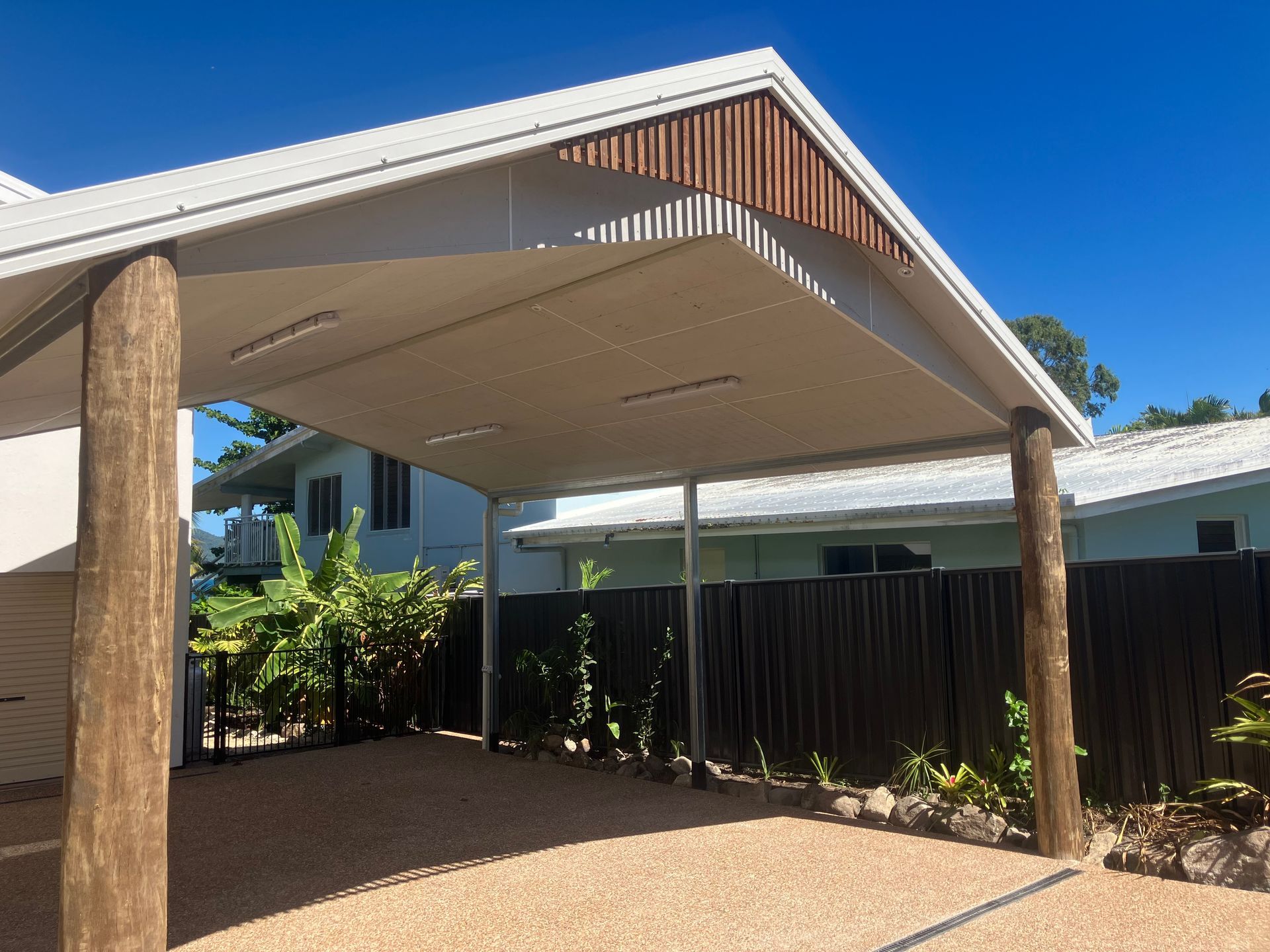 Covered Carport With Timber Posts and Corrugated Metal Roof — RYDALL BUILDING AND DEVELOPMENT in Freshwater, QLD