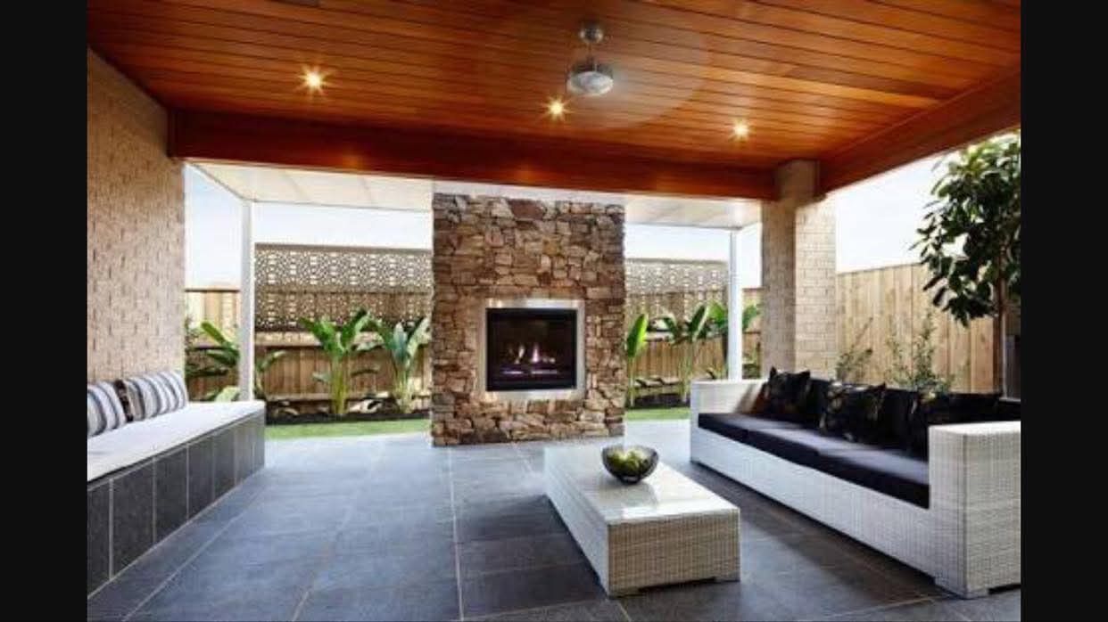 Outdoor Patio With Covered Wood Ceiling, Stone Fireplace and Furniture — RYDALL BUILDING AND DEVELOPMENT in Freshwater, QLD