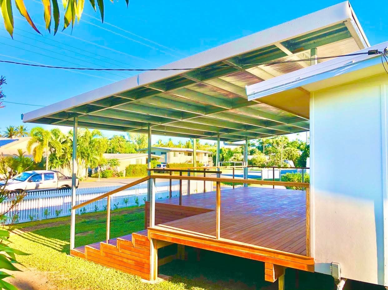 Covered Wooden Deck Beside a Bright Turquoise Pool — RYDALL BUILDING AND DEVELOPMENT in Freshwater, QLD
