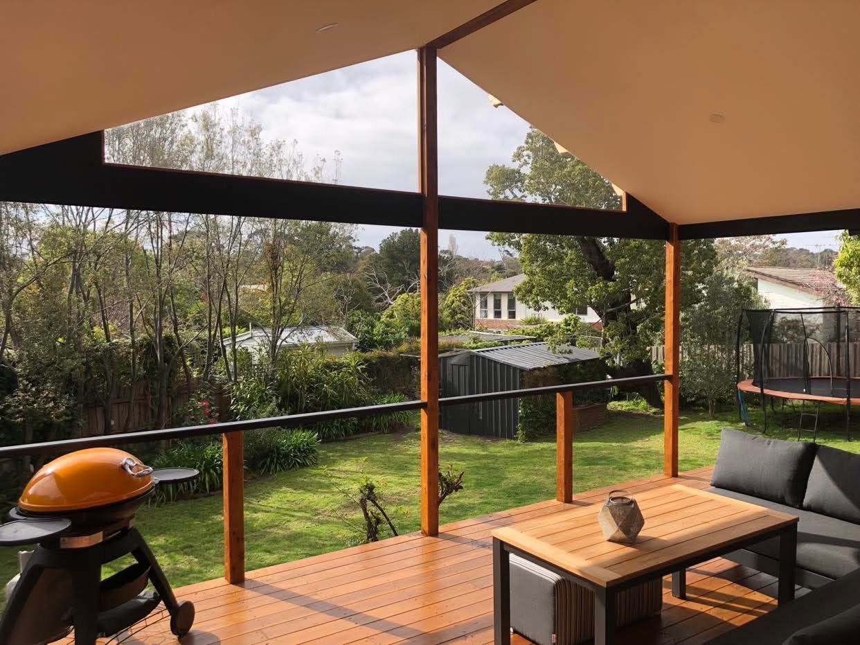 A Wooden Patio With Two Ceiling Fans — RYDALL BUILDING AND DEVELOPMENT in Freshwater, QLD