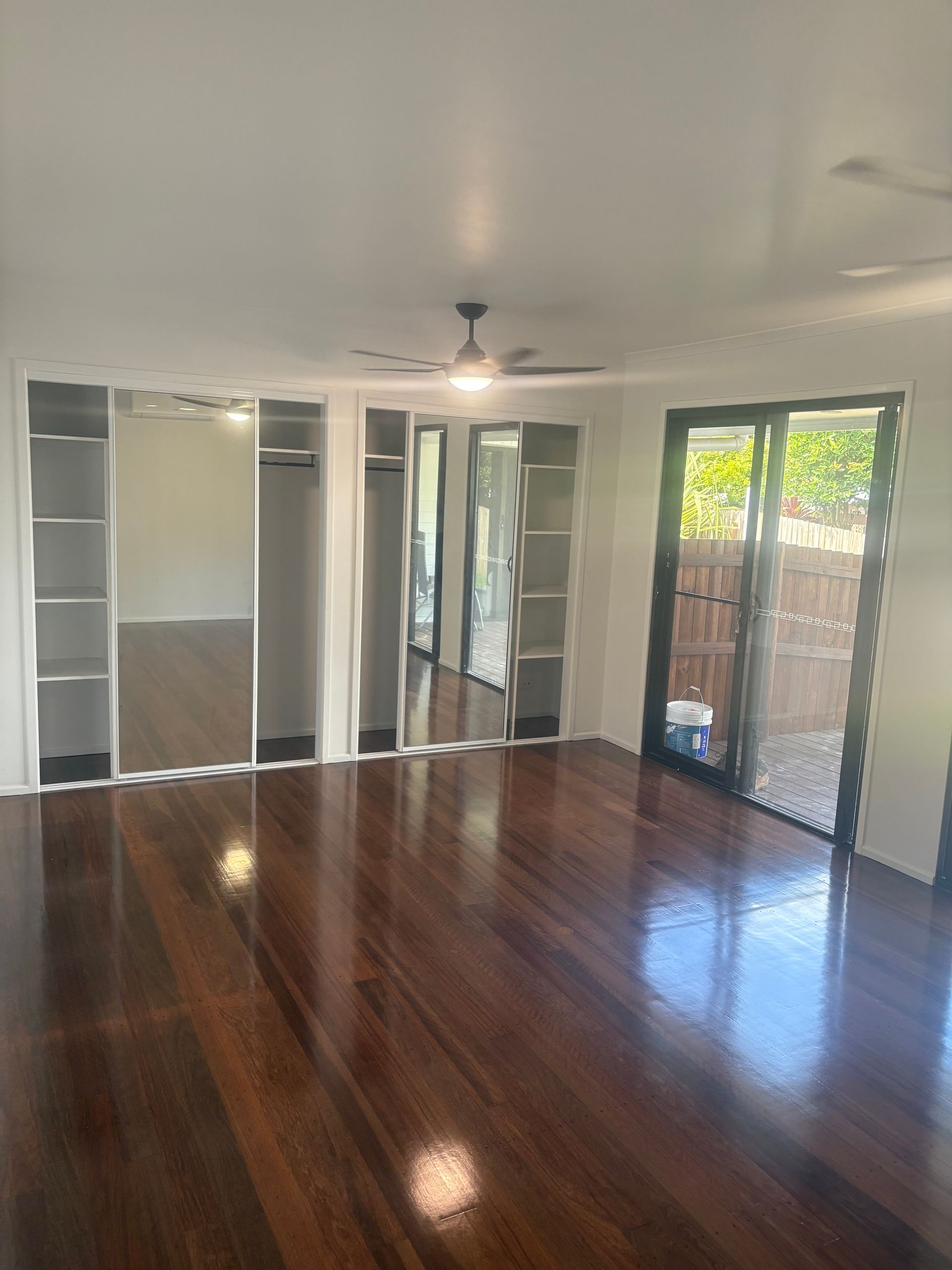Empty Modern Room With Glossy Hardwood Floors — RYDALL BUILDING AND DEVELOPMENT in Freshwater, QLD