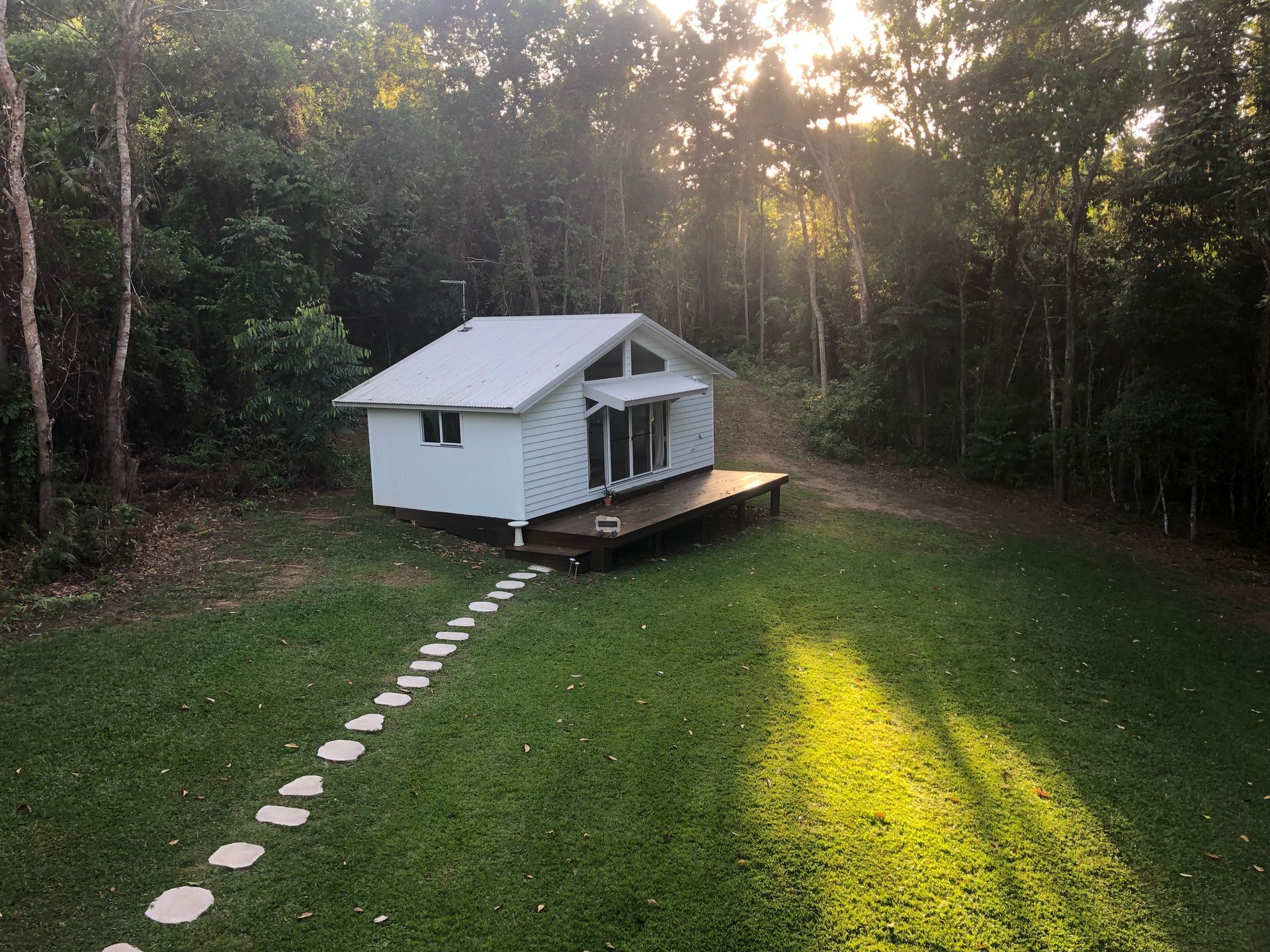 A Wide Wooden Deck Covered by a Gabled Roof Extension — RYDALL BUILDING AND DEVELOPMENT in Freshwater, QLD