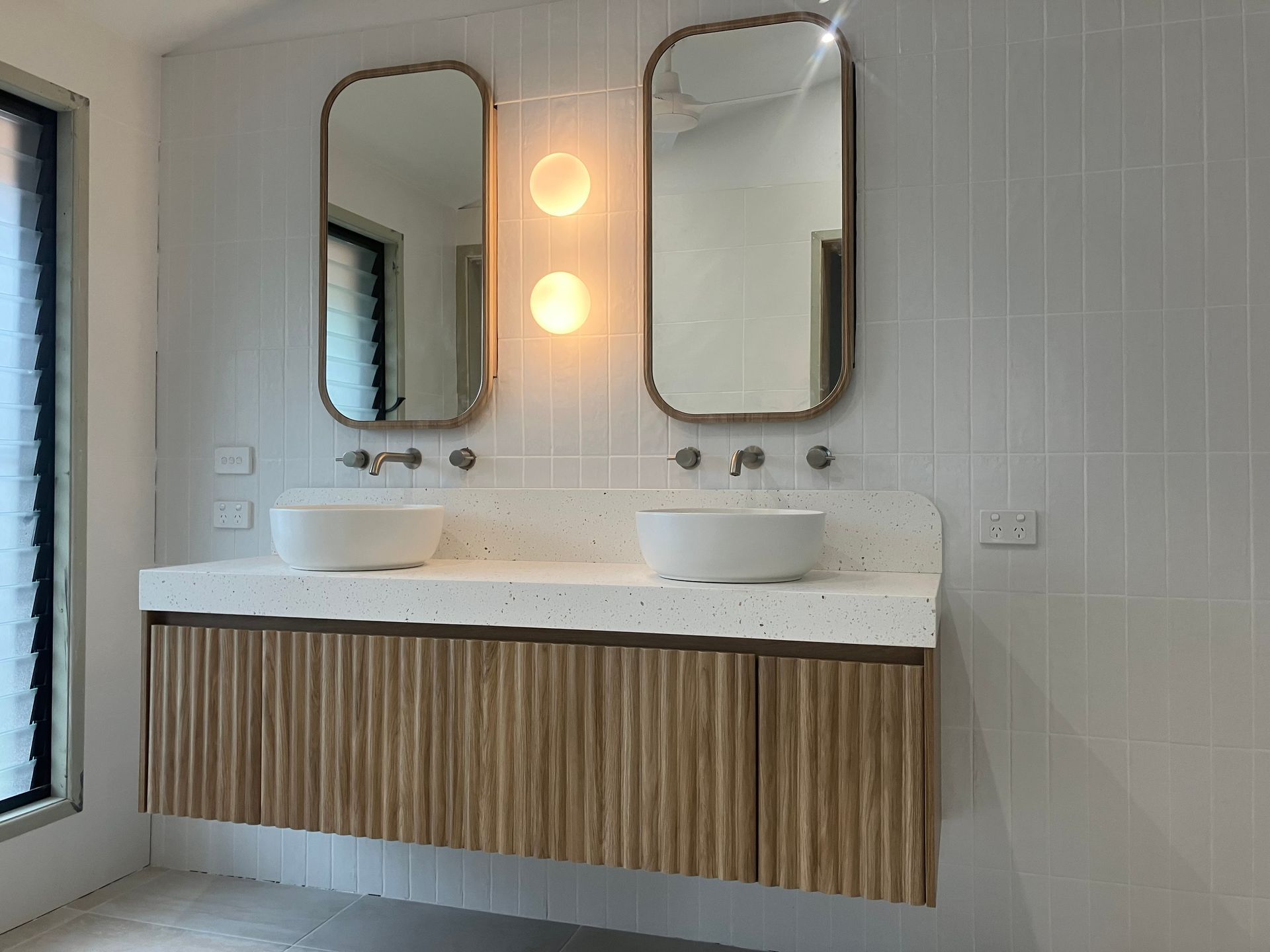 Modern Bathroom Vanity With Double Sinks and Backlit Mirrors — RYDALL BUILDING AND DEVELOPMENT in Freshwater, QLD