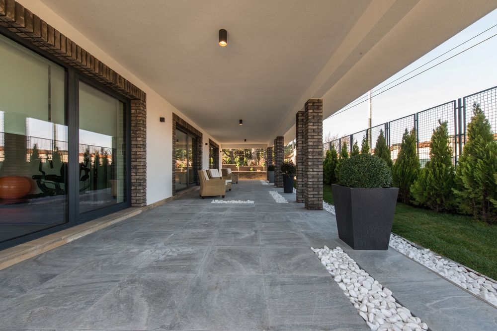 A Large Patio With a Lot of Windows and Plants — Taggerts Discount Carpets & Vinyls In California Gully, VIC