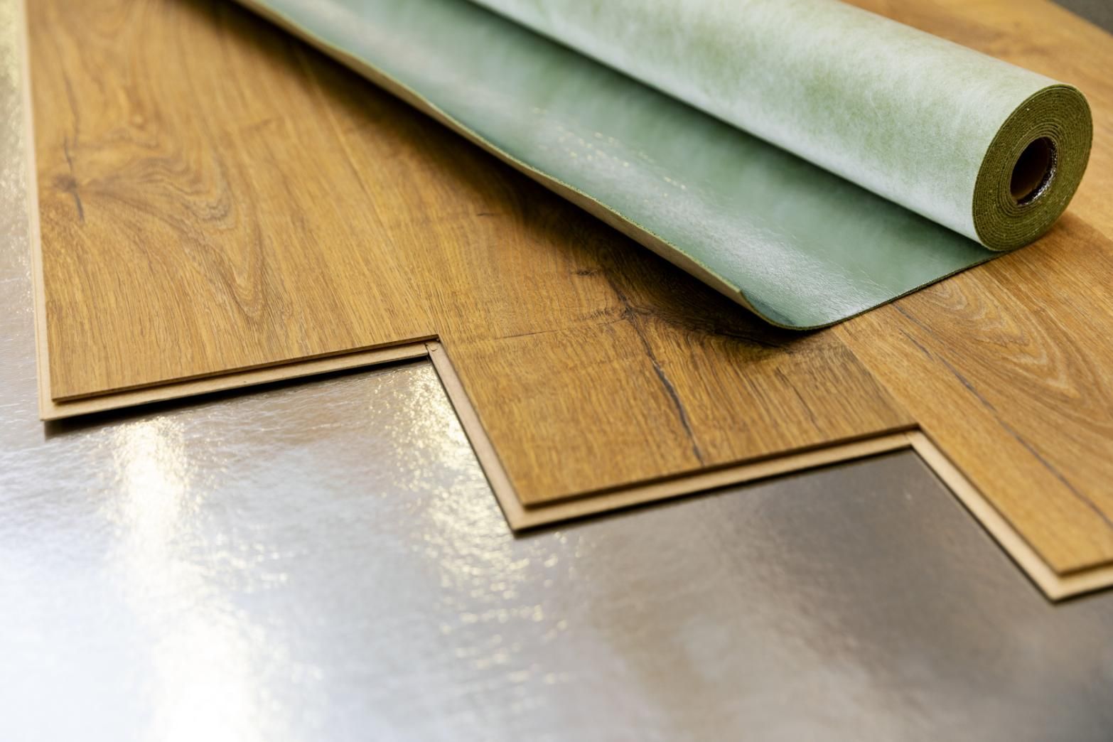 A Roll of Insulation is Sitting on Top of a Wooden Floor — Taggerts Discount Carpets & Vinyls In California Gully, VIC