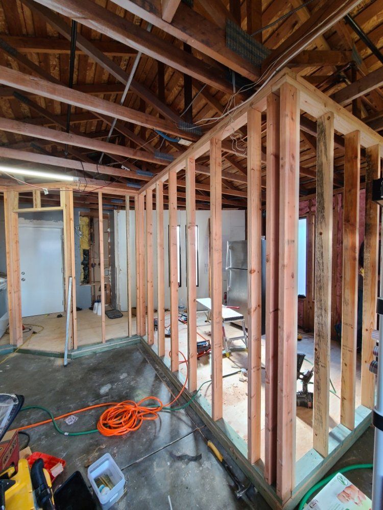 A room is being built with wooden beams and a ceiling.