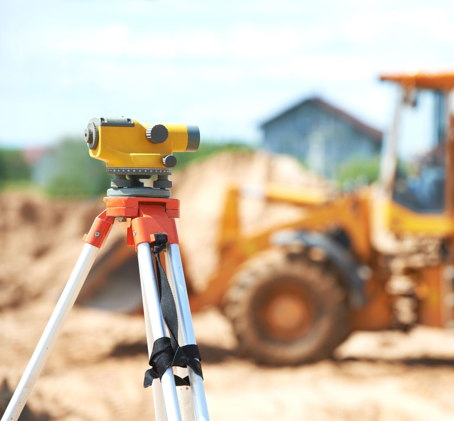 survey equipment on tripod at construction area site