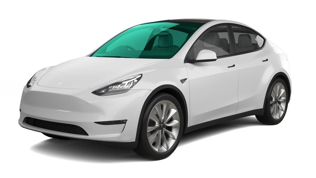 White Tesla Model Y electric SUV with teal-tinted windows, angled towards the viewer.