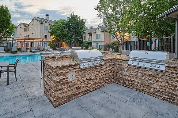 Outdoor grilling area with two stainless steel grills — Apartments for Rent Boise