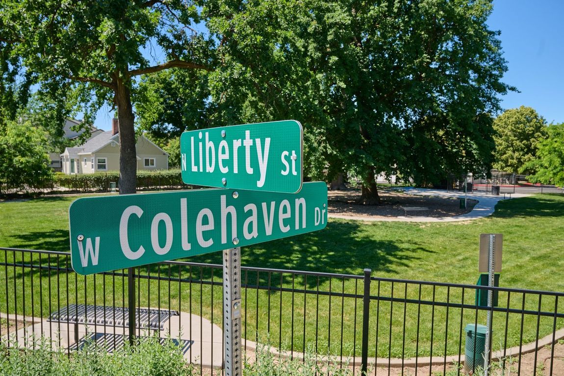 Green street signs for Liberty St and Colehaven Dr at a park — boise apartments for rent
