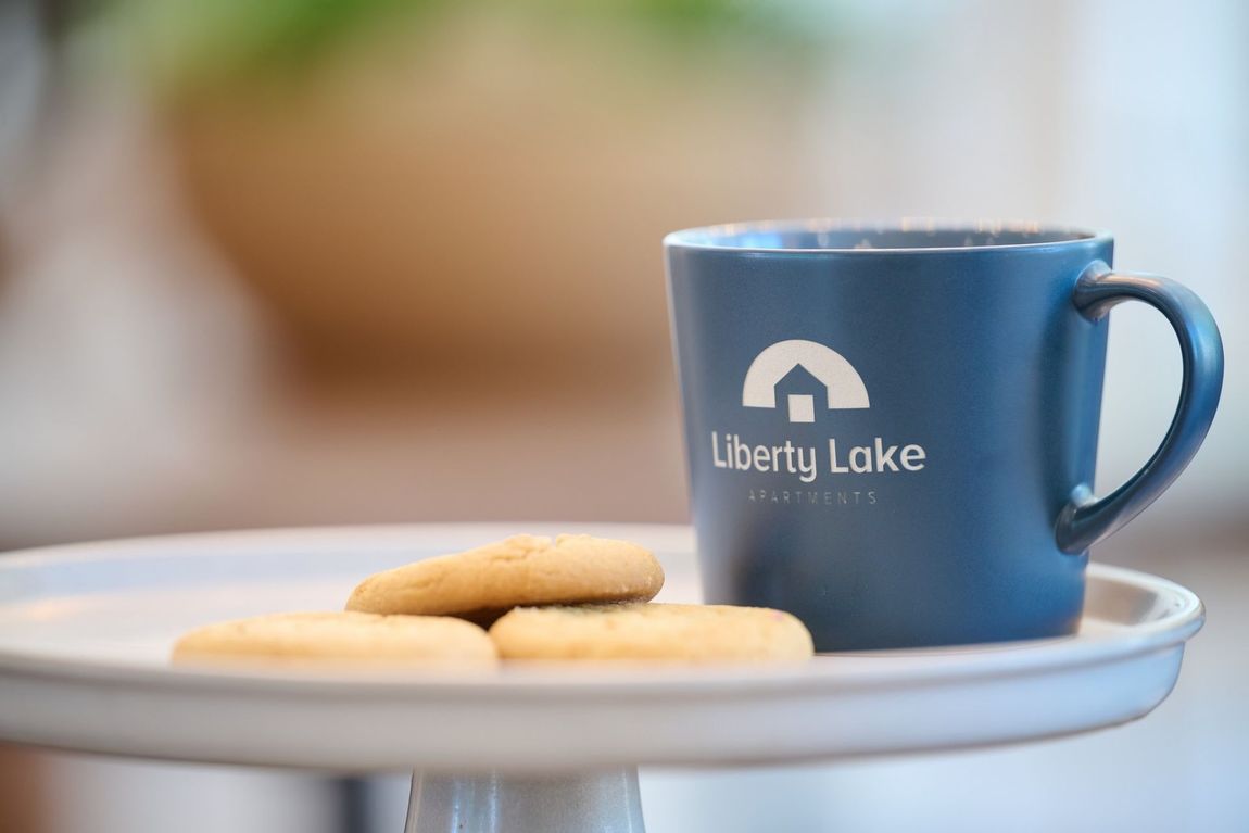 Blue mug with Liberty Lake logo — boise apartments for rent
