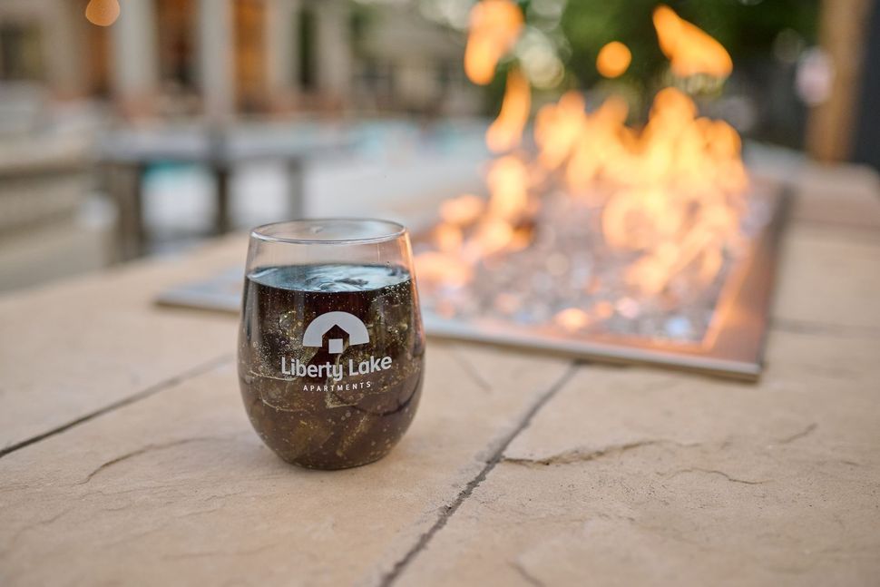 A glass of dark liquid — Apartments for Rent Boise