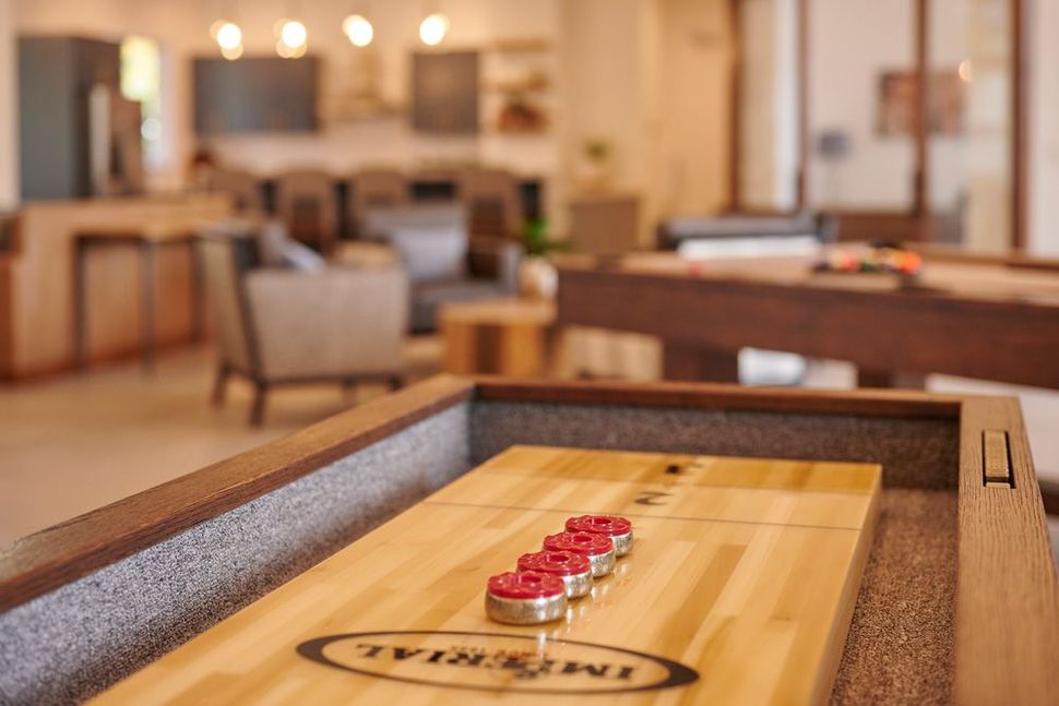 Shuffleboard game with red pucks lined up — Apartments for Rent Boise