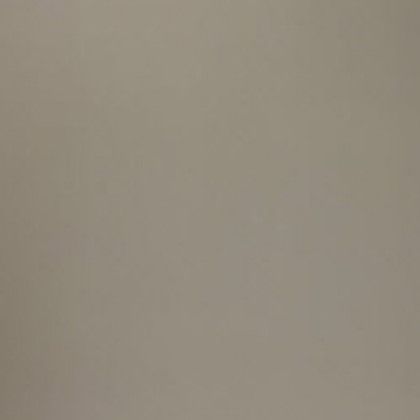 Plain beige wall with a faint shadow near the upper right.