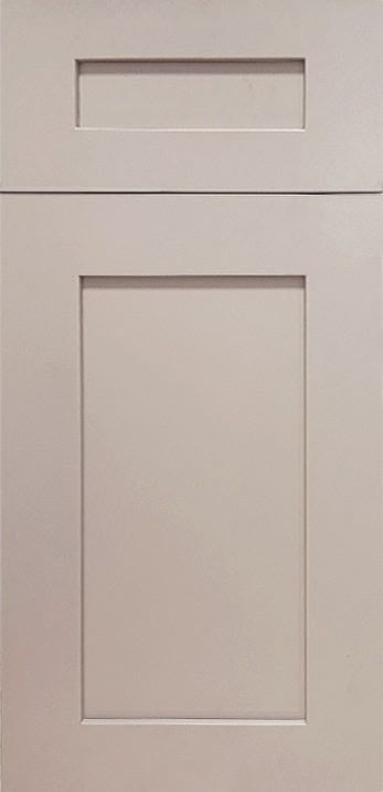 White cabinet door with a small drawer above a larger panel drawer front
