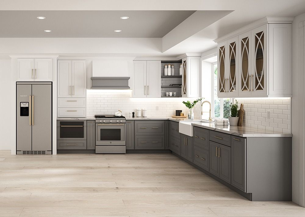 Bright modern white kitchen with gray cabinets, stainless appliances, and wood floors