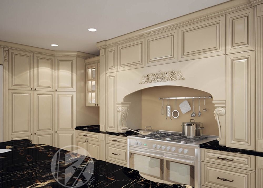 Elegant cream kitchen with ornate cabinets, black granite counters, and stainless steel stove under arched hood.