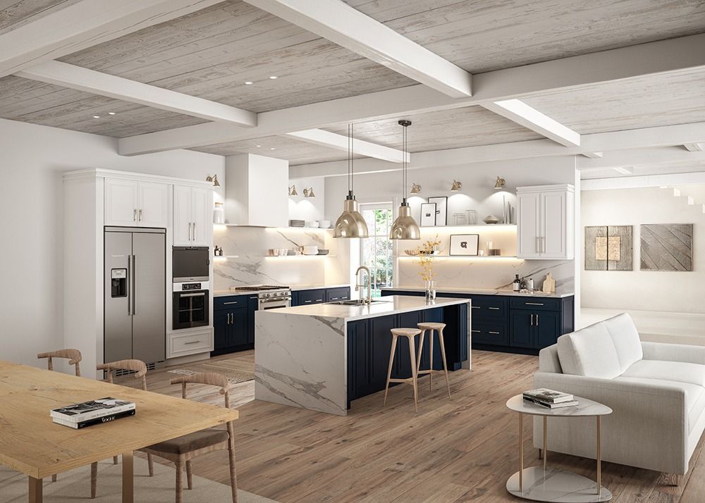Bright modern kitchen and living room with white beams, navy cabinets, island stools, and white sofa.