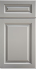Gray cabinet door with raised panel and small top drawer front